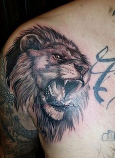 roaring lion chest tattoos